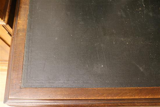 An early 20th century oak pedestal desk, W.143cm